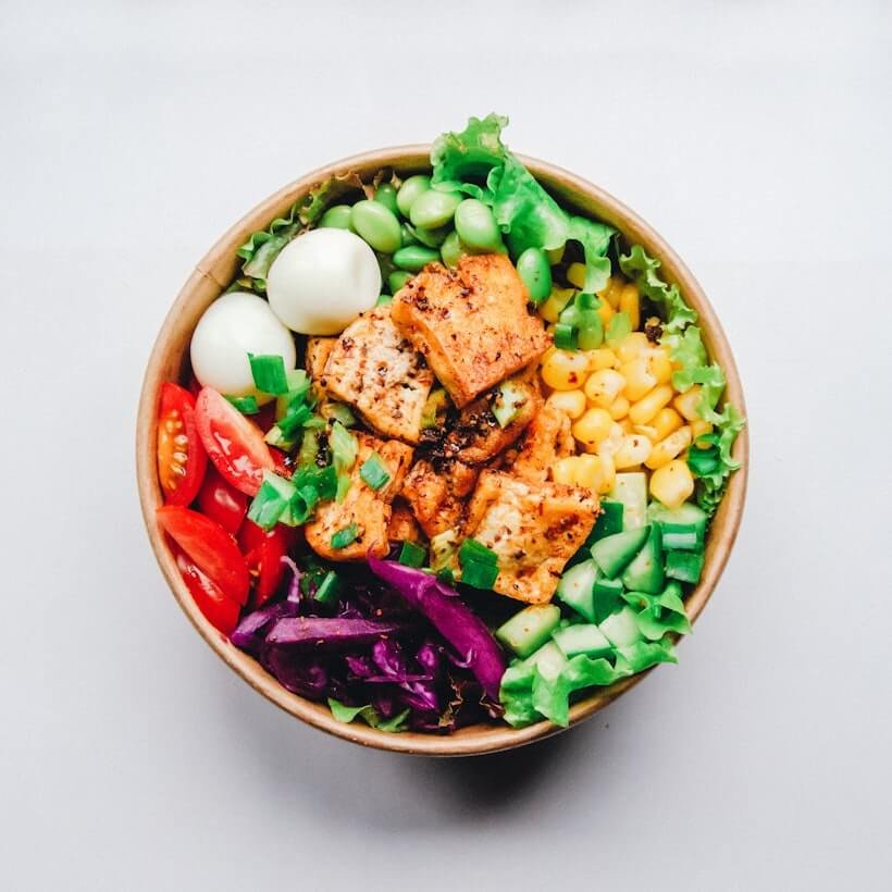Anti-inflammatory foods — salmon, avocado, leafy greens — that support clearer skin